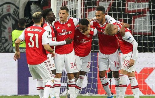 Arsenal's players celebrate after English midfielder Joe Willock (centre) scored the opening goal at Eintracht Frankfurt on Thursday in the Europa League