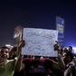 Protesters shout slogans as they take part in a protest calling for the removal of President Abdel Fattah al-Sisi in downtown Cairo on September 20