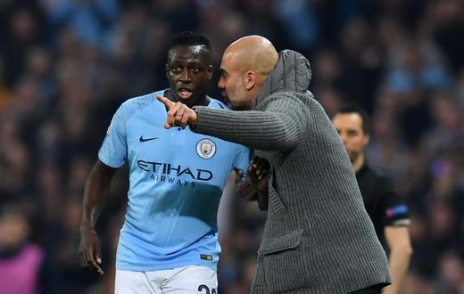 Manchester City manager Pep Guardiola gestures to Benjamin Mendy