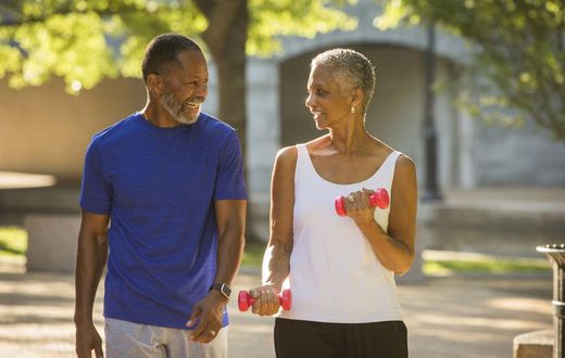 Black couple walking in park