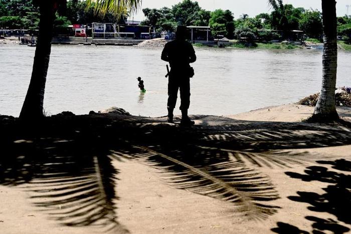 A member of the Mexican National Guard patrols the banks of the Suchiate River in Chiapas State, Mexico, in July 2019 in an effort to prevent illegal migrant crossings