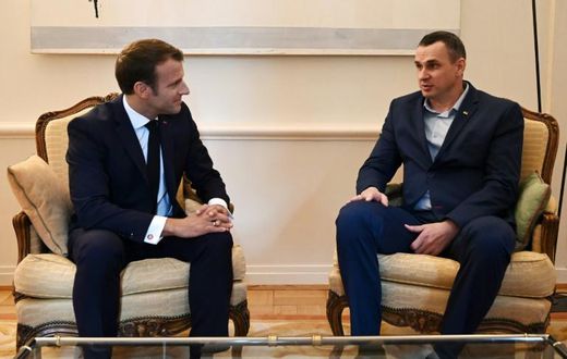 French President Emmanuel Macron (left) meets Ukrainian film director Oleg Sentsov, released last month by Russia in a prisoner swap with Kiev
