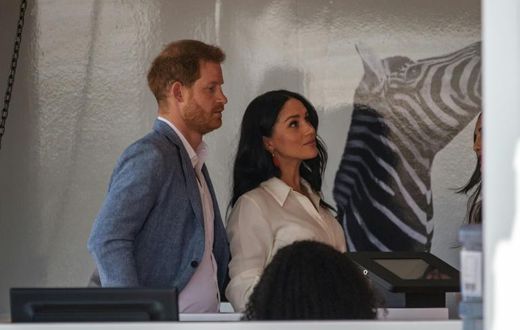 Helping hand: Prince Harry and his wife Meghan, the Duchess of Sussex, at a youth employment hub in Johannesburg