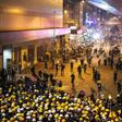 Tear gas filled Hong Kong's commercial district on Sunday