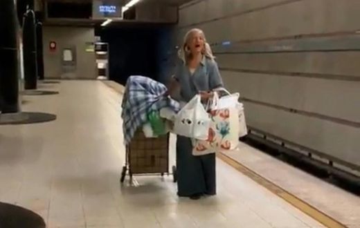 This handout video frame grab from the Los Angeles Police Department shows a homeless woman singing opera in the Los Angeles metro on September 26, 2019