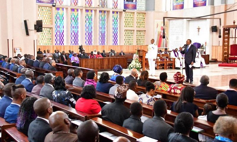 President Uhuru Kenyatta addresses the congregation during 40th commemoration of Mzee Jomo Kenyatta's death. Members of the public invited for 41st commemoration at Holy Family Basilica