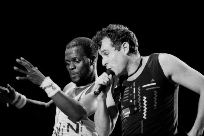 Johnny Clegg (R) performed in the band Savuka for years under apartheid until group member Dudu Zulu (L) was shot dead in 1992 and dancer Dudu Zulu of South African band Savuka perform on stage at the Amnesty International Concert on October 10, 1988 i...