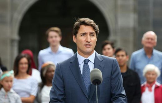 Canadian Prime Minister Justin Trudeau's reputation took a hit over images of him wearing blackface makeup, but a poll suggests his electability remains intact