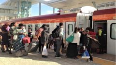 File image of passengers boarding a train
