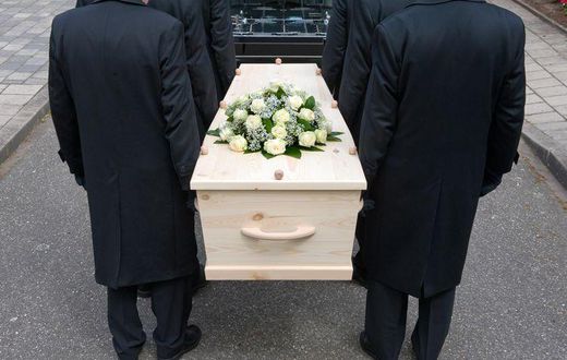 Pallbearers carrying a casket
