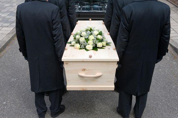 Pallbearers carrying a casket
