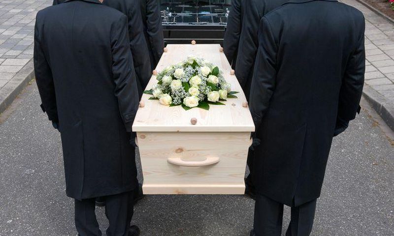 Pallbearers carrying a casket