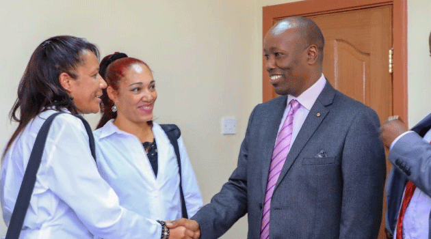 Nakuru Governor Lee Kinyanjui with two Cuban doctors posted to his county