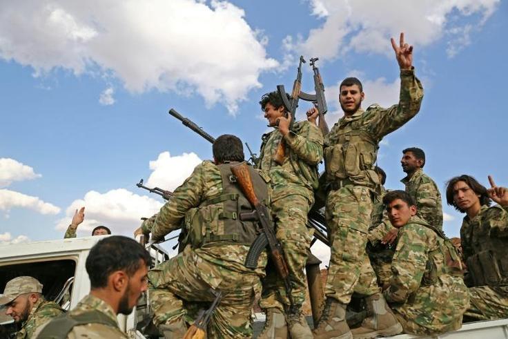 Turkish-backed Syrian rebel fighters are gathering near the Syrian-Turkish border in preparation for a Turkish offensive against Kurdish forces