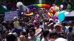 Men and women in colourful costumes, including several dressed as samba dancers, paraded through the streets on motorised floats or sashayed alongside