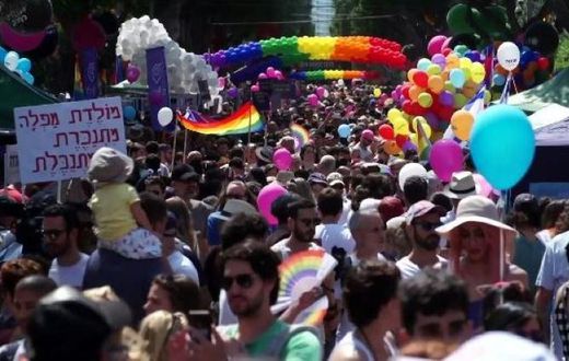 Men and women in colourful costumes, including several dressed as samba dancers, paraded through the streets on motorised floats or sashayed alongside