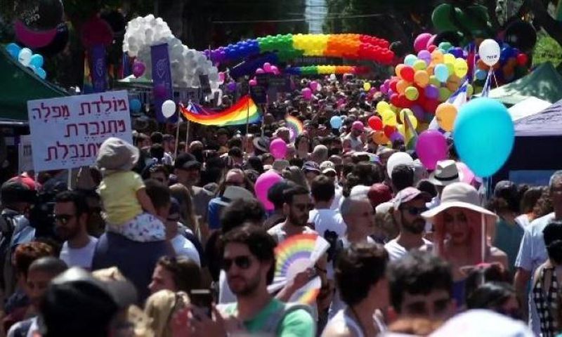 Men and women in colourful costumes, including several dressed as samba dancers, paraded through the streets on motorised floats or sashayed alongside