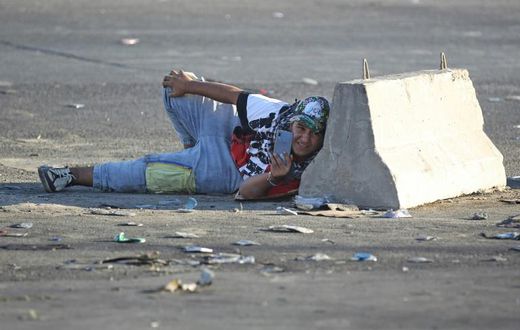 Protesters have used mobile phones to film against a backdrop of tear gas volleys and live rounds during demonstrations that have gripped Iraq since Tuesday