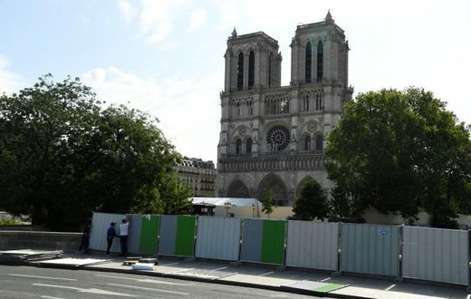 Workers installed fencing around Notre-Dame Cathedral in August as they began lead clean-up operations