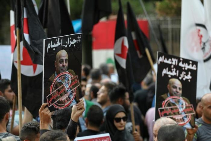 Former detainees of the pro-Israel South Lebanon Army (SLA) militia protested in Beirut on Thursday with posters of Amer al-Fakhoury marked "the butcher of Khiyam"