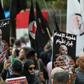 Former detainees of the pro-Israel South Lebanon Army (SLA) militia protested in Beirut on Thursday with posters of Amer al-Fakhoury marked "the butcher of Khiyam"