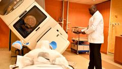 A specialist using a radiology machine