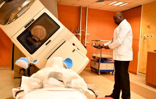 A specialist using a radiology machine