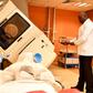 A specialist using a radiology machine