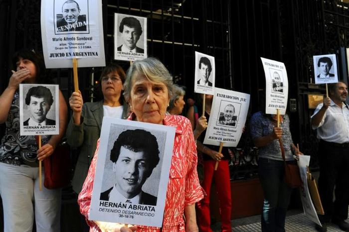 Relatives of Hernan Abriata, who was arrested in 1976 in Argentina and has been missing ever since, protest in front of the French embassy in Buenos Aires in 2014