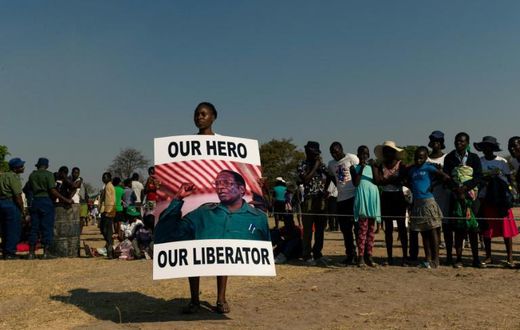 Mugabe's body was greeted to a low-key farewell in his home village