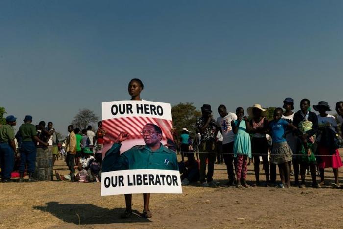 Mugabe's body was greeted to a low-key farewell in his home village