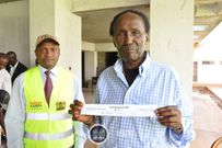 Chris Kirubi holding the Huduma Namba Acknowledgement slip (Twitter)