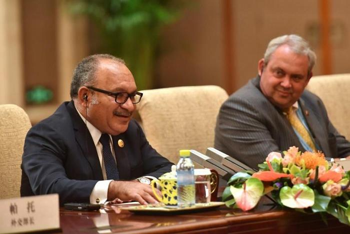 Papua New Guinea's Prime Minister Peter O'Neill could face a vote on his eight-year premiership following a string of high-profile political defections