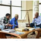 Eric Omondi with the late  Safaricom CEO Bob Collymore