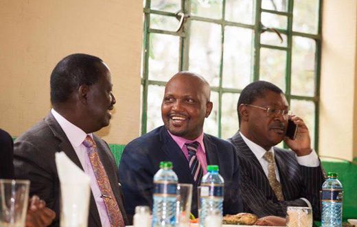Gatundu South MP Moses Kuria with Opposition leader Raila Odinga