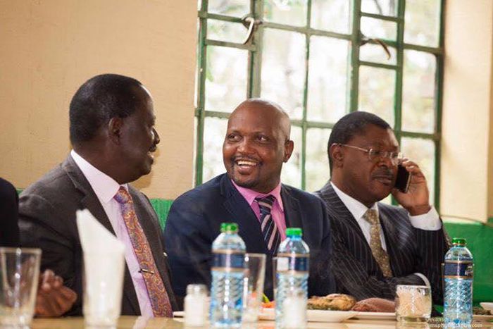 Gatundu South MP Moses Kuria with Opposition leader Raila Odinga