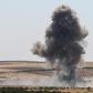 Smoke billows after reported regime air strikes near Khan Sheikhun in Syria's Idlib province