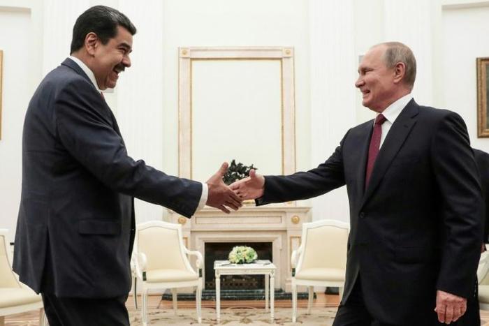 Russian President Vladimir Putin (R) welcomed embattled Venezuelan President Nicolas Maduro to the Kremlin urging dialogue with the opposition