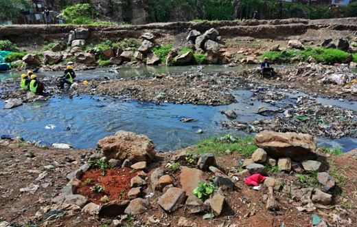 Rock arrangements mark the ground where authorities say bodies, mostly babies, were recovered from Nairobi's rivers