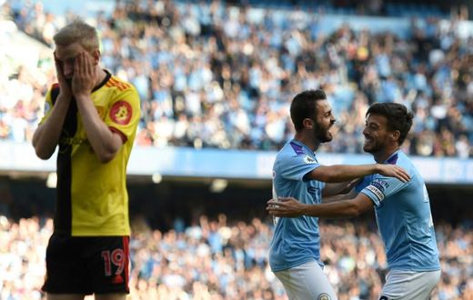 Manchester City's Bernardo Silva (C) celebrates a goal in his side's rout of Watford