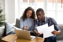 Couple discussing finances (Courtesy)
