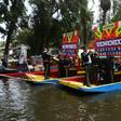 Mariachis onboard "Trajineras" offer their music to visitors in Mexico City's Xochimilco in early October