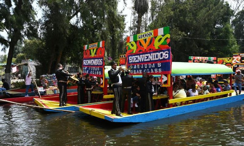 Mariachis onboard "Trajineras" offer their music to visitors in Mexico City's Xochimilco in early October