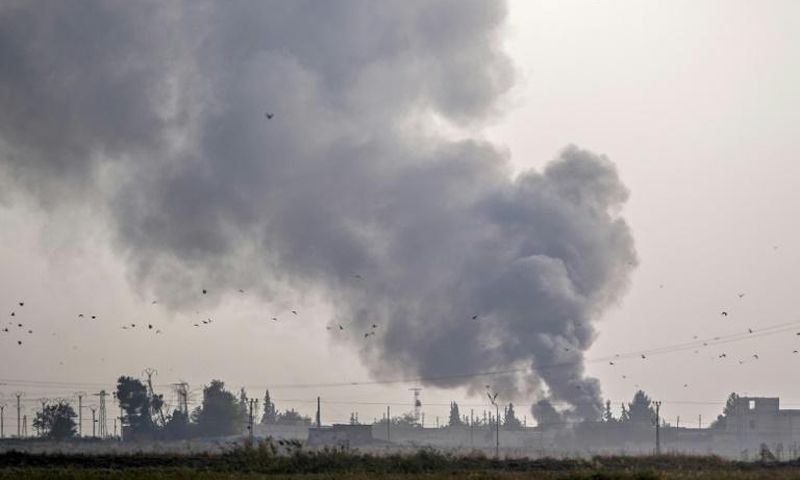 The Turkish military hits Kurdish-controlled towns along the border with air strikes and artillery fire before ground troops cross into Syria