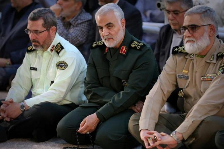 Iranian Major General in the Islamic Revolutionary Guard Corps (IRGC) Qasem Soleimani (C) is on a UN sanctions blacklist that the United States says must be updated to be properly enforced