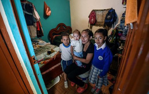 Venezuelan Yisela Palencia poses with her children in Bogota, Colombia