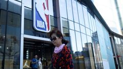 A bipartisan group of eight US lawmakers on Wednesday urged NBA commissioner Adam Silver to suspend all league activities in China until a sponsor and telecast boycott ends, which would close such places as the NBA merchandise store in Beijing