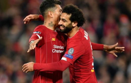 Mo Salah celebrates with Roberto Firmino after scoring in Liverpool's Champions League win over Salzburg on Wednesday