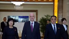 FIFA President Gianni Infantino (C) was one of the few people allowed to see the surreal game play out