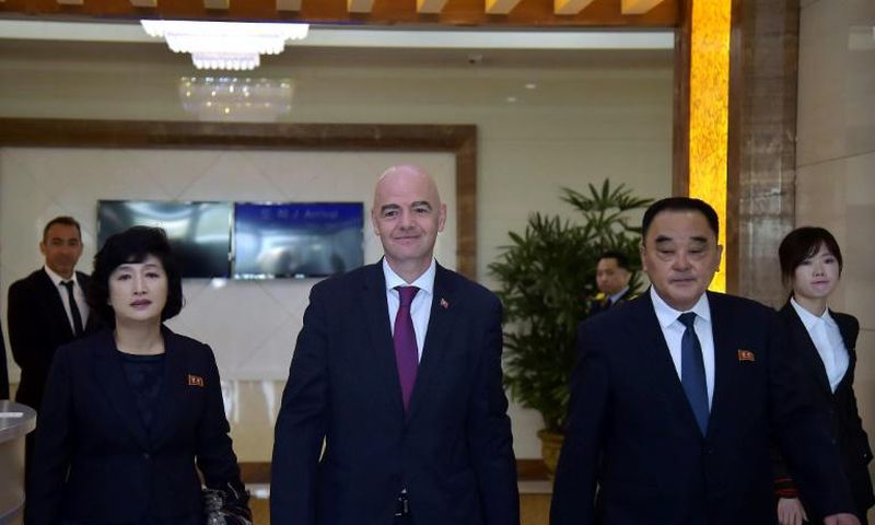 FIFA President Gianni Infantino (C) was one of the few people allowed to see the surreal game play out